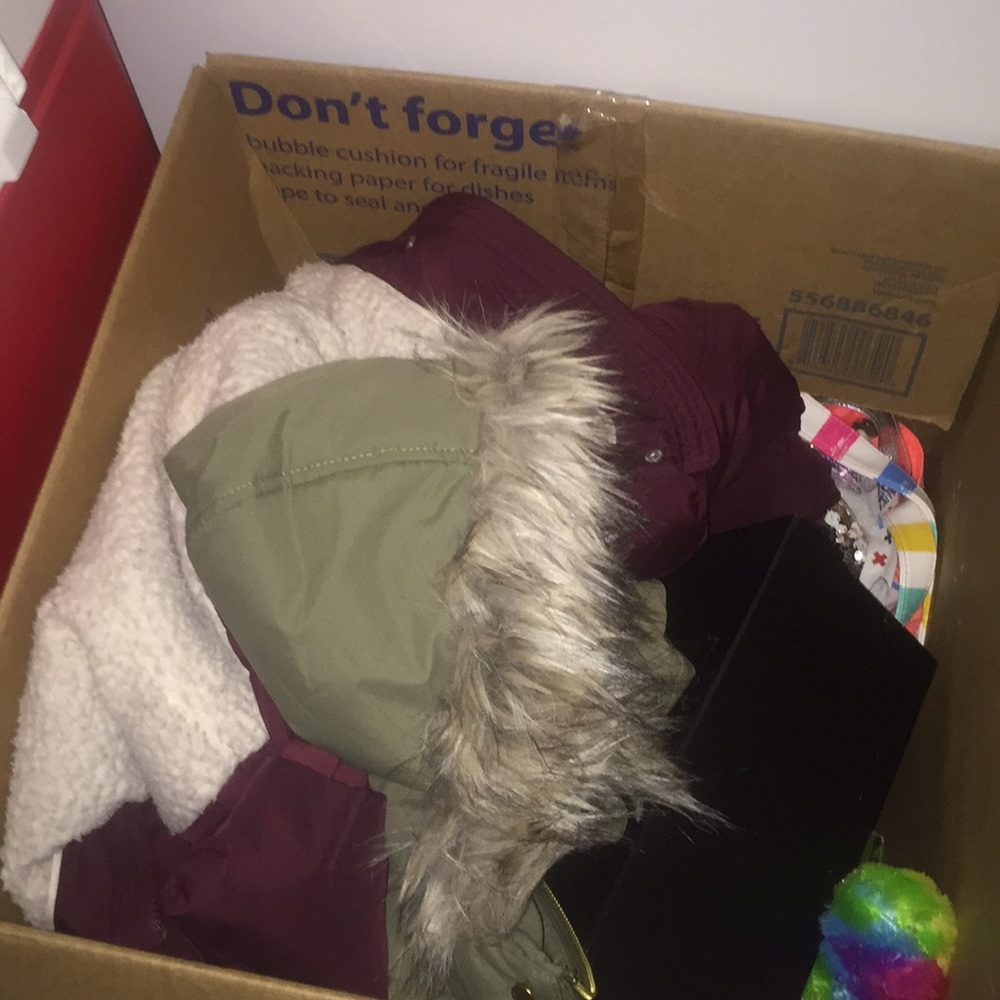 Box full of clothing,purses